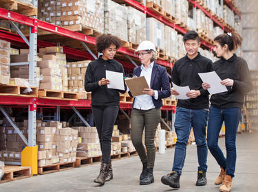 CET team tours warehouse facility 